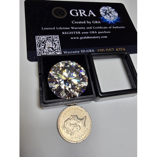 231 - A stunning very rare and large 30ct Belgian Cut Clear Moissanite Diamond with a diameter of 20mm wit... 