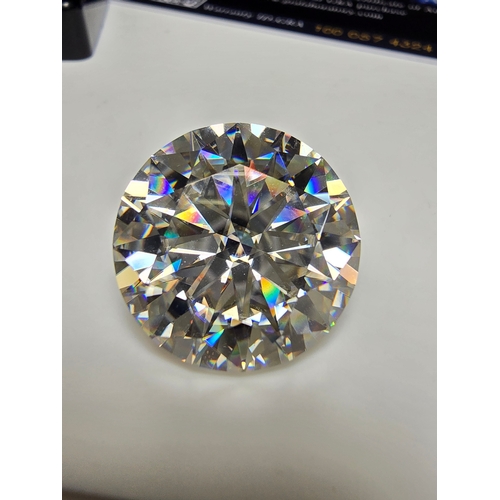 231 - A stunning very rare and large 30ct Belgian Cut Clear Moissanite Diamond with a diameter of 20mm wit... 