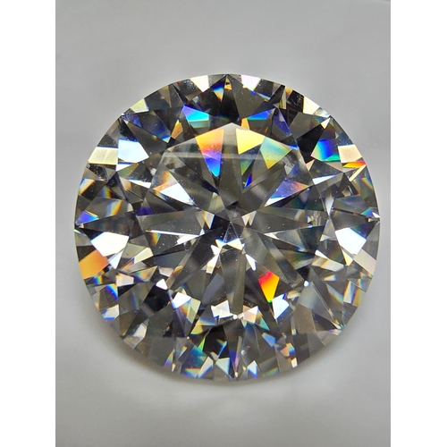 231 - A stunning very rare and large 30ct Belgian Cut Clear Moissanite Diamond with a diameter of 20mm wit... 