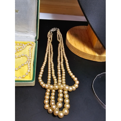 194 - Bundle of 3x vintage faux pearl necklaces and a 925 silver bangle, to include a cased set of majoric... 