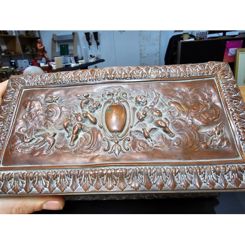 240 - Good quality ornate antique copper writing casket with an embossed design depicting classical scenes... 