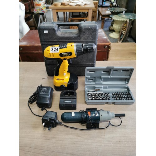 A cordless drill, an Einhell screwdriver, black and decker bits and