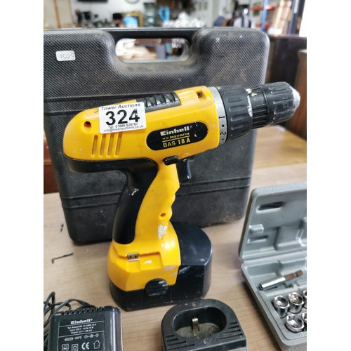 A cordless drill, an Einhell screwdriver, black and decker bits and