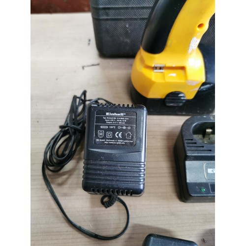 A cordless drill, an Einhell screwdriver, black and decker bits and