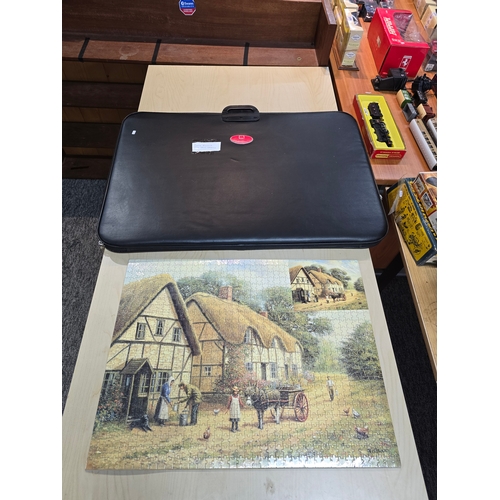 24A - Large puzzle in as new condition along with a good large puzzle storage and carrier case.