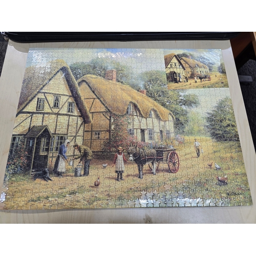 24A - Large puzzle in as new condition along with a good large puzzle storage and carrier case.