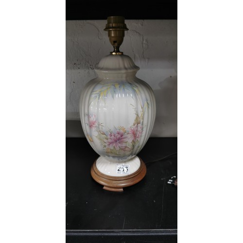 347 - Pretty floral porcelain table lamp with wooden base in very good clean condition. Height 41cm.