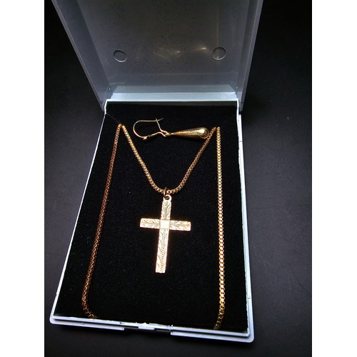 305 - A 9ct yellow gold cross pendant set on a very long gold plated 27