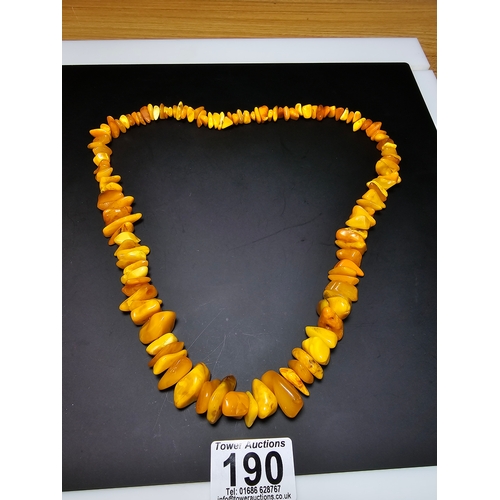 190 - A good quality vintage genuine butterscotch amber beaded necklace featuring polished shaped amber be... 