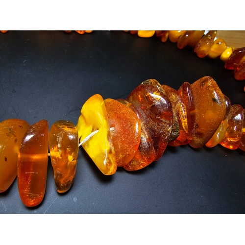 192 - A good quality vintage genuine baltic amber beaded necklace featuring polished shaped amber beads wi... 