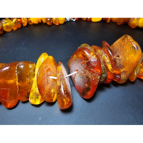 192 - A good quality vintage genuine baltic amber beaded necklace featuring polished shaped amber beads wi... 