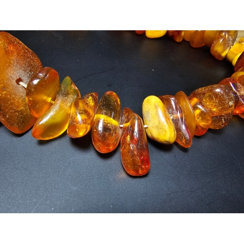 192 - A good quality vintage genuine baltic amber beaded necklace featuring polished shaped amber beads wi... 