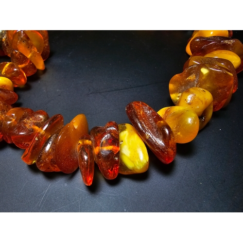 192 - A good quality vintage genuine baltic amber beaded necklace featuring polished shaped amber beads wi... 