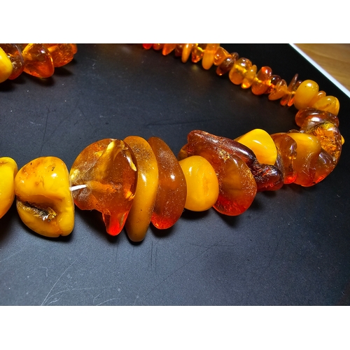 192 - A good quality vintage genuine baltic amber beaded necklace featuring polished shaped amber beads wi... 