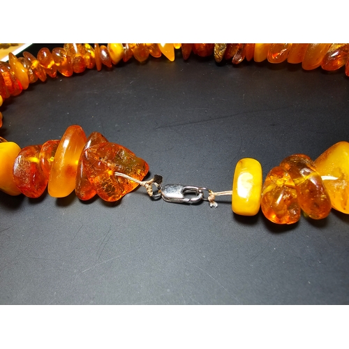 192 - A good quality vintage genuine baltic amber beaded necklace featuring polished shaped amber beads wi... 