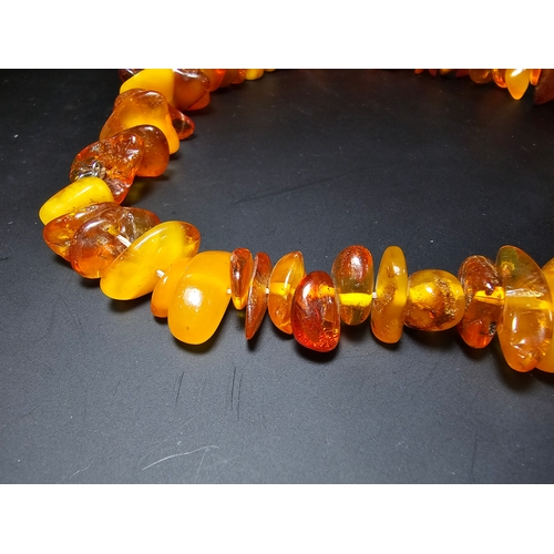 192 - A good quality vintage genuine baltic amber beaded necklace featuring polished shaped amber beads wi... 