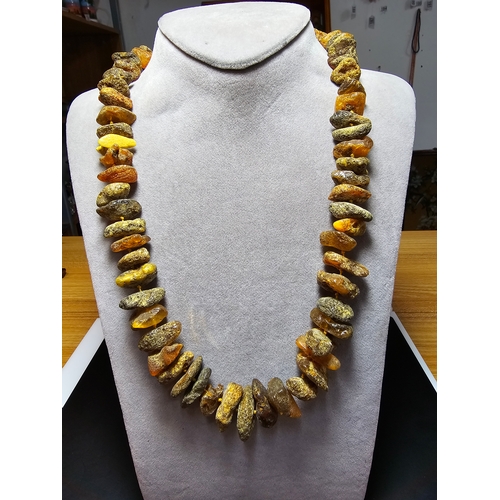 193 - A good quality vintage genuine butterscotch amber beaded necklace featuring natural amber beads are ... 