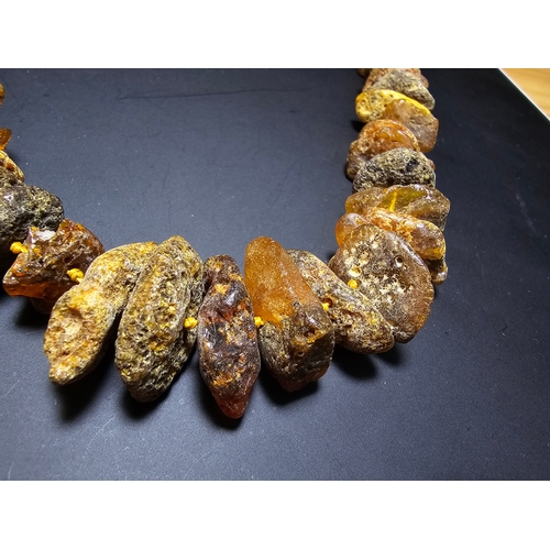 193 - A good quality vintage genuine butterscotch amber beaded necklace featuring natural amber beads are ... 