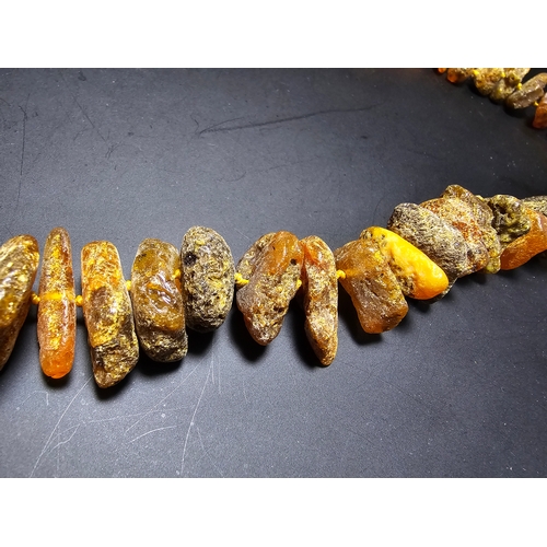 193 - A good quality vintage genuine butterscotch amber beaded necklace featuring natural amber beads are ... 