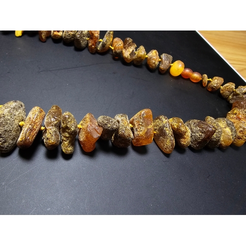 193 - A good quality vintage genuine butterscotch amber beaded necklace featuring natural amber beads are ... 