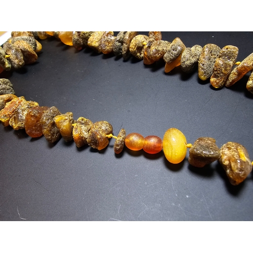 193 - A good quality vintage genuine butterscotch amber beaded necklace featuring natural amber beads are ... 