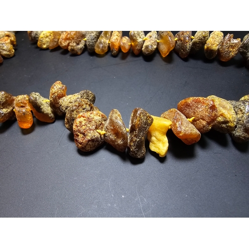 193 - A good quality vintage genuine butterscotch amber beaded necklace featuring natural amber beads are ... 