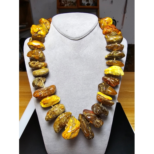 194 - A good vintage genuine amber large beaded necklace featuring loosely polished & shaped natural amber... 