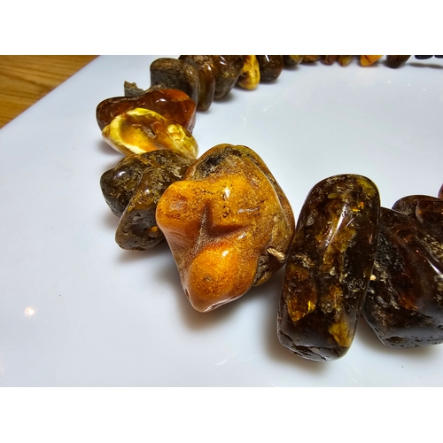 194 - A good vintage genuine amber large beaded necklace featuring loosely polished & shaped natural amber... 