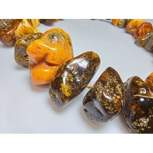 194 - A good vintage genuine amber large beaded necklace featuring loosely polished & shaped natural amber... 