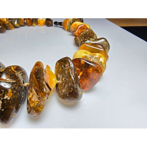 194 - A good vintage genuine amber large beaded necklace featuring loosely polished & shaped natural amber... 