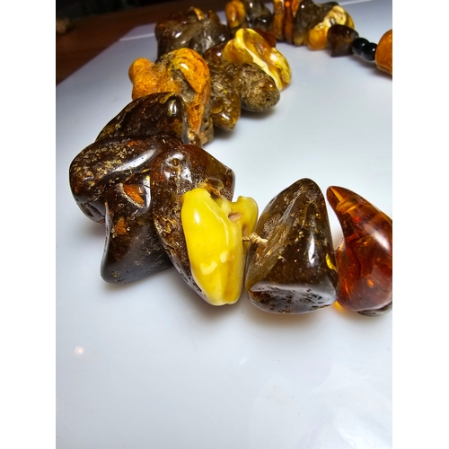 194 - A good vintage genuine amber large beaded necklace featuring loosely polished & shaped natural amber... 