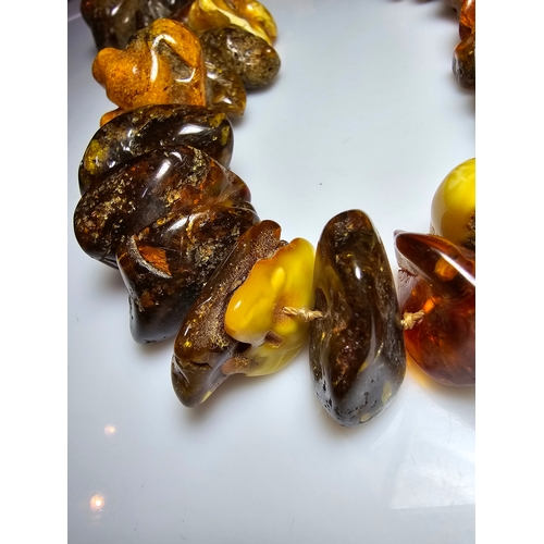 194 - A good vintage genuine amber large beaded necklace featuring loosely polished & shaped natural amber... 