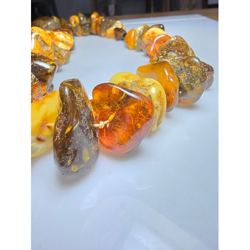 194 - A good vintage genuine amber large beaded necklace featuring loosely polished & shaped natural amber... 