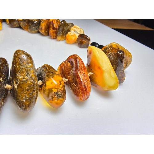 194 - A good vintage genuine amber large beaded necklace featuring loosely polished & shaped natural amber... 