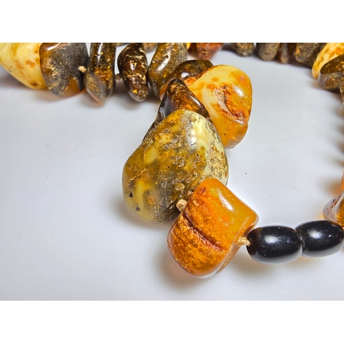 194 - A good vintage genuine amber large beaded necklace featuring loosely polished & shaped natural amber... 