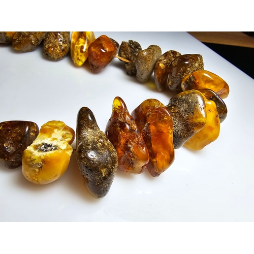 194 - A good vintage genuine amber large beaded necklace featuring loosely polished & shaped natural amber... 