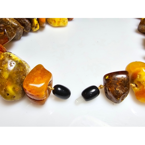 194 - A good vintage genuine amber large beaded necklace featuring loosely polished & shaped natural amber... 