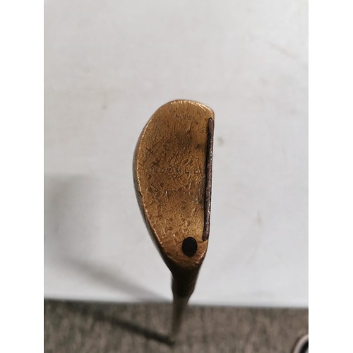 2 - An antique wooden hickory shafted golf putter made by H.E. Northwood, model medium lie, in good over... 