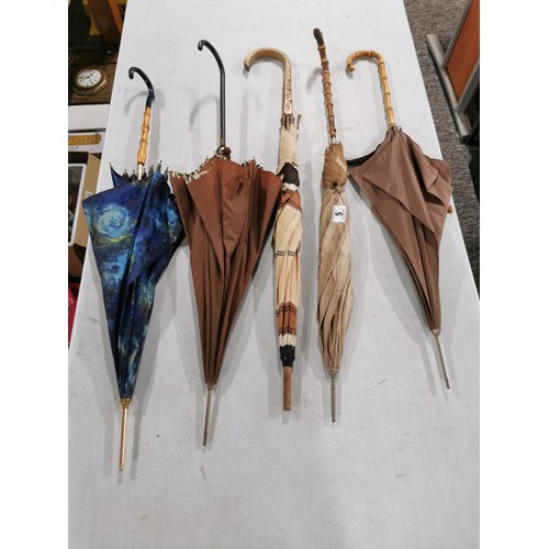 5 - A collection of vintage umbrellas some with bamboo handles, all appear to be in good order.