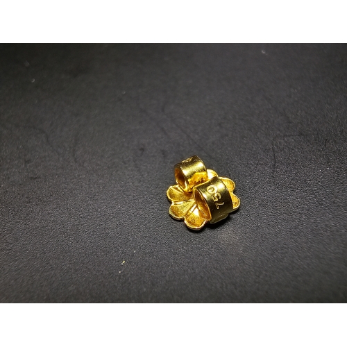 301 - Pair of good quality unused solid 18ct yellow gold stud earrings featuring an intricately worked flo... 