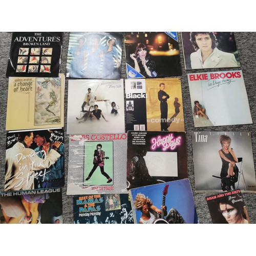 13 - A large quantity of LP vinyl records to include artists such as Status Quo, Beach boys, Steve Wonder... 