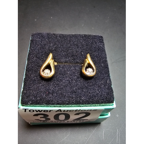 302 - Pair of 9ct yellow gold stud earrings both inset with a real diamond, in good clean condition comple... 