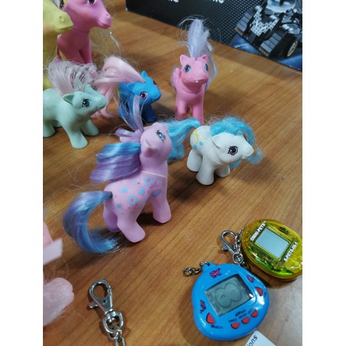 23 - A quantity of vintage 1980's My little Pony items along with a Tamagotchi Angel from 1997 along with... 