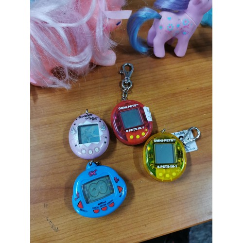 23 - A quantity of vintage 1980's My little Pony items along with a Tamagotchi Angel from 1997 along with... 