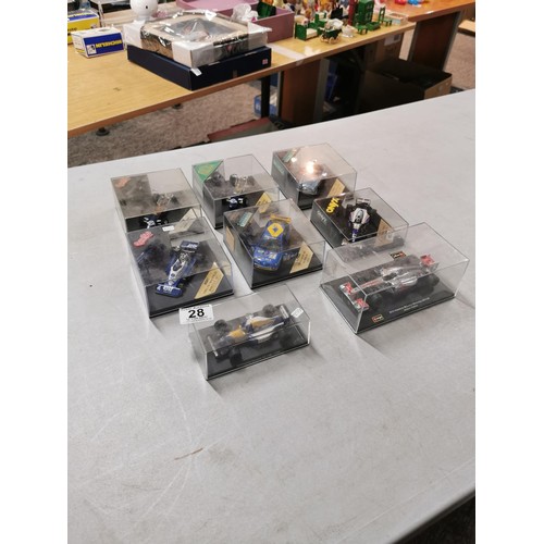 28 - A collection of 8 collectable diecast model cars in their clear presentation boxes to include Burago... 