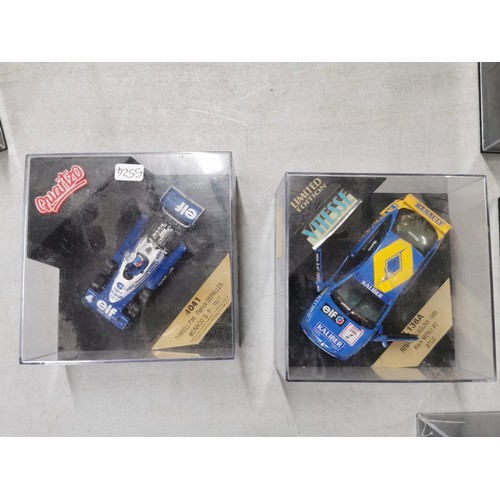 28 - A collection of 8 collectable diecast model cars in their clear presentation boxes to include Burago... 