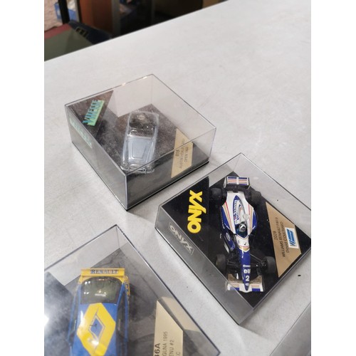 28 - A collection of 8 collectable diecast model cars in their clear presentation boxes to include Burago... 