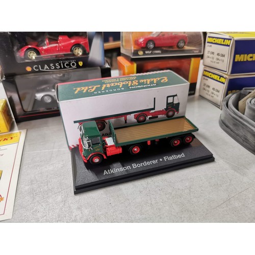 29 - A quantity of various boxed diecast model cars along with an Eddie Stobart Flatbed truck along with ... 