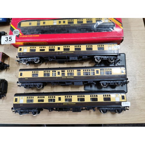 35 - A quantity of Hornby 00 gauge coaches and rolling stock along with a Smokey Joe Hornby loco, 3 of th... 