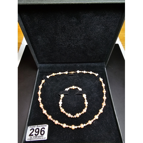 296 - Good quality matching Genuine Pearl necklace and expandable bracelet featuring 10k gold beads to the... 